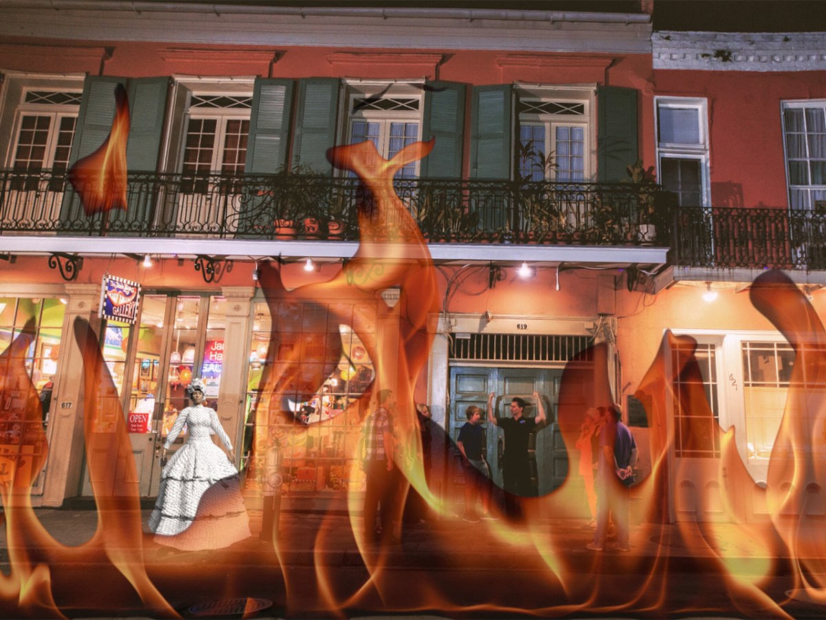 Flames overlay on a nighttime street scene with people standing and shops visible.