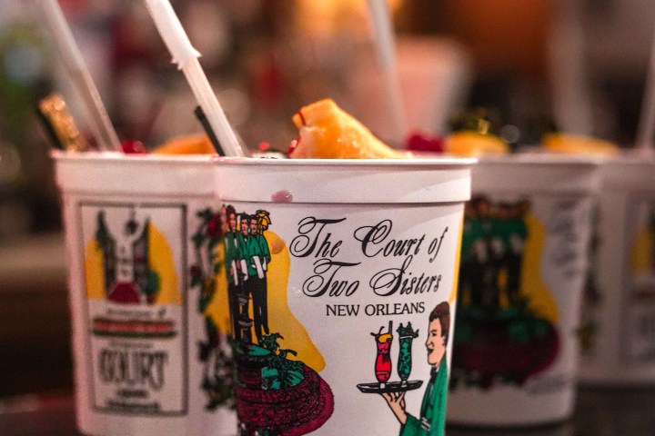 Close-up of decorative cups with straws from The Court of Two Sisters, New Orleans.